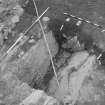 Edinburgh Castle, settlement. Excavation photograph: area H - completely excavated rock cut pit with 435 compacted ashy floor to S.