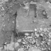 Edinburgh Castle, settlement. Excavation photograph: area H - lower larger cobbling sloping down to W in SW corner of area.