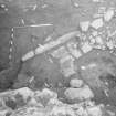 Edinburgh Castle, settlement. Excavation photograph: area H - hearths and stone flagging of causeway.