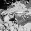 Edinburgh Castle, settlement. Excavation photograph : area H - detail section through causeway.