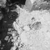 Edinburgh Castle, settlement. Excavation photograph: area H - jumble of cobbles in N of trench.