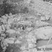 Edinburgh Castle, settlement. Excavation photograph: area H - cobbles removed to reveal unworked bedrock.