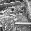 Edinburgh Castle, settlement. Excavation photograph : area H - general view under ice and snow, with excavated furnace and floor.