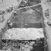 Edinburgh Castle, settlement. Excavation photograph: area H - NW facing face with rubble (core?) 312 behind.