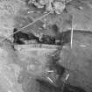 Edinburgh Castle, settlement. Excavation photograph: area H - part excavated W side of furnace showing construction cut through 366.