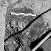 Edinburgh Castle. Excavation photograph : area H - detail of smithing slag in north-east corner.