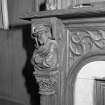 Library, detail carved figure on fireplace