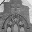 Detail.  Window and carved panel on E gable.