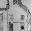 View of 34 Rodger Street, Anstruther Easter, from W, showing Brydie Confectioner.