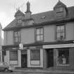 View of 16-18 Glasgow Street, Ardrossan, from NW, showing the Horse Shoe bar and The City of Glasgow Friendly Society.