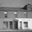 View of 19-23 Princes Street, Ardrossan, from SW, showing the premises of R Miller, hairdresser and Katherine.