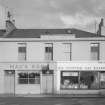 View of 33-39 Princes Street, Ardrossan, from SW, showing Mac's Bar and Scottish Gas Board.