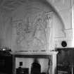 Interior view of Craigievar Castle showing fireplace in hall.