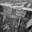 Interior.
Byre, view of stalls in W wall.