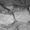 Excavation photograph : trench IX - detail of nails and burning at internal wall.