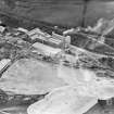 General view, showing Coltness Cement works, sign visible on side of main building reads: 'Coltness Portland Cement Works' - view from SW facing NE