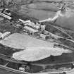 General view, showing Coltness Cement works, sign visible on side of main building reads: ' Coltness Portland Cement Works' - view from SW facing NE