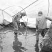 View of unidentifed people in flooded area