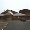 General view from W of main entrance of new school building