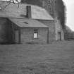 View of Evelaw Tower and farm buildings from W.