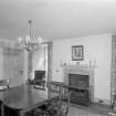 Interior view of Wedderlie House showing dining room with fireplace.