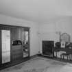 Interior view of Wedderlie House showing first floor bedroom with fireplace.