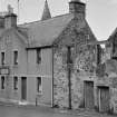 View of buildings in Cross Wynd, Falkland, including Westfield Fish Restaurant.