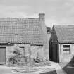 View of two cottages, (house and outbuildings, Bett), Cross Wynd, Falkland.