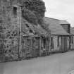 View of buildings in Back Wynd, Falkland, including Smith and Anderson's stable and store.