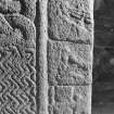 Detail of cross-slab at Ardchattan, showing musicians and warrior on the right of the cross-shaft on face A.
 
