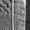 Detail of cross-slab at Ardchattan, showing musicians and warrior on the right of the cross-shaft on face A.
 
