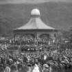 View of the Ross Bandstand, Princes Street Gardens, Edinburgh showing orchestra and spectators.