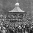 View of the Ross Bandstand, Princes Street Gardens, Edinburgh showing orchestra and spectators.