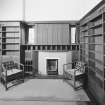 Hill House, Helensburgh. Interior.
View of library, fireplace and overmantel with chairs