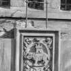 West elevation - armorial panel and bell-mounting