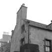 View of Hermits and Termits, 64 St Leonard's Street, Edinburgh, showing the chimney and windows of the S corner from S.