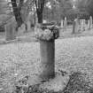 View of stone basin set on the stump of Kettins mercat cross located in the burial ground at Kettins Parish Church.