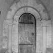 Interior.
S porch, inner end, detail of Romanesque doorway with nookshafts and cushion capitals.