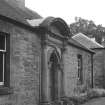 View of pedimented entrance to stable block.
