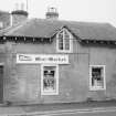 View of Mace Mini-Market, High Street, Ayton, from NW.