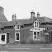 View of High Street, Ayton, from N, including Mace Mini-Market and antiques shop.