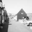 General view of fishermen's huts and Seaview Terrrace from SE.