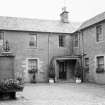 View inside courtyard showing stables converted to residences.