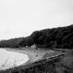 Distant view of house and sea wall