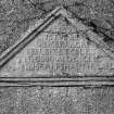 Detail - triangular inscribed stone in wall