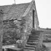 View of steading N wing gable with external stair rising to doorway.