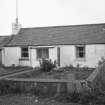 General view of unidentified cottage in West End.