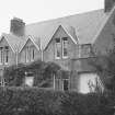 General view of facade of unidentified 2-storey house