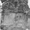 Detail showing gravestone.