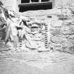 Detail of armorial panel above door.